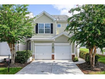 Charming two-story home with a two-car garage and beautifully landscaped front yard at 246 Cavendar Way # 16, Marietta, GA 30066