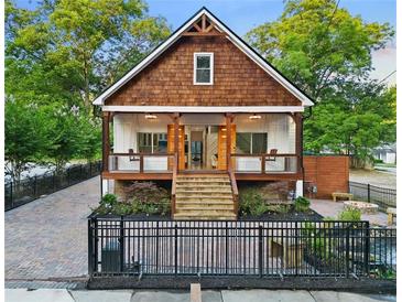 Charming craftsman style home with a welcoming front porch and manicured landscaping at 1060 Mcdaniel Sw St, Atlanta, GA 30310