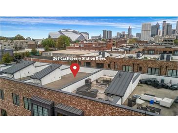 Relaxing rooftop deck with outdoor seating and skyline views, perfect for entertaining guests at 267 Castleberry Station Sw Dr, Atlanta, GA 30313