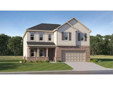 Charming two-story home with brick and siding, a covered entry, and an attached two-car garage at 236 Paisley Way, Locust Grove, GA 30248