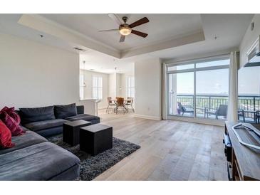 Bright living room with a sectional sofa, and a balcony with a view at 325 E Paces Ferry Ne Rd # 1405, Atlanta, GA 30305