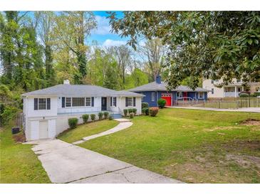 Charming one-story home featuring a well-maintained yard, driveway, and inviting curb appeal at 111 Leathers Circle Nw, Atlanta, GA 30314