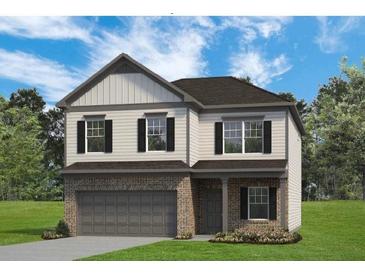 Charming two-story home featuring a two-car garage, brick accents, and symmetrical window placement at 321 Silver Leaf Trce, Douglasville, GA 30134