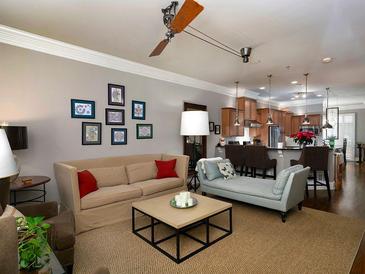 Comfortable living room featuring an open layout with modern lighting and a cozy seating area at 62 Emerson Hill Sq, Marietta, GA 30060
