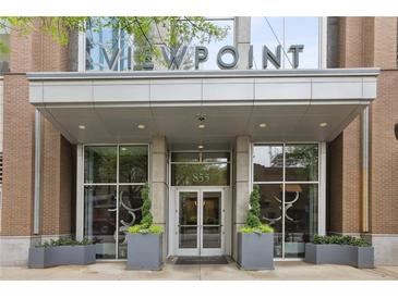 Modern building entrance features sleek design and well-maintained landscaping at Viewpoint Condominiums at 855 Peachtree Ne St # 3005, Atlanta, GA 30308