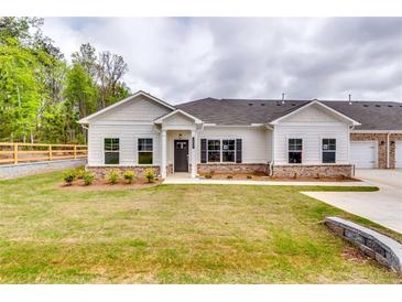Charming single-story home with landscaped lawn and white siding at 3904 Shelleydale Dr, Powder Springs, GA 30127