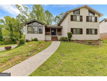 Charming two-story home with a landscaped front yard and inviting entrance at 5429 Golfcrest Cir, Stone Mountain, GA 30088
