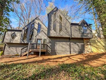 Modern two-story home with unique architectural features and professionally landscaped front yard at 3248 Holly Mill Run, Marietta, GA 30062