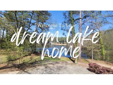 Scenic lake view with mature trees at this beautiful property for your dream lake home at 336 Sir Richard Ct, Jonesboro, GA 30236