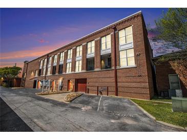 Beautiful brick exterior showcasing expansive windows and balcony feature for a unique living experience at 1133 Church St # 1, Covington, GA 30014