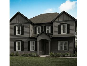 Charming two-story home featuring a well-manicured lawn, gray siding, and classic black shutters at 2740 Byess Ct, Marietta, GA 30064
