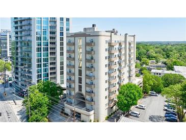 Upscale apartment building with a beautiful facade and balconies, showcasing city living at 2161 Peachtree Ne Rd # 907, Atlanta, GA 30309