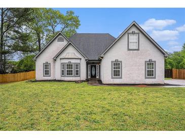 Charming single-story home with a well-maintained lawn and inviting curb appeal at 609 Alyssa Ct, Locust Grove, GA 30248