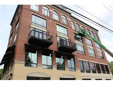 Modern brick building with black framed windows and balconies gives an urban feel at 319 Atlanta Se St # 317, Marietta, GA 30060