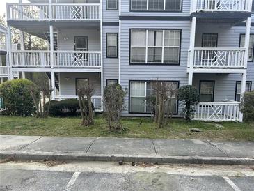 Apartment building featuring balconies and well-maintained landscaping at 3518 Shepherds Path, Decatur, GA 30034