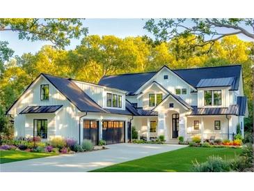 Stunning two-story home boasts a pristine white exterior, black accents, and a lush green lawn at 146 Sherwood Ln, Canton, GA 30115