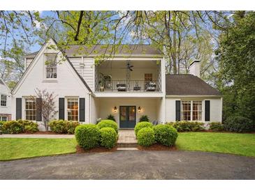 Charming two-story home featuring a balcony, manicured landscaping, and a welcoming entrance at 78 Beverly Ne Rd, Atlanta, GA 30309