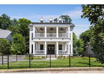 Stunning two-story home with a double-decker front porch, perfect for enjoying the outdoors at 542 Orme Ne Cir, Atlanta, GA 30306