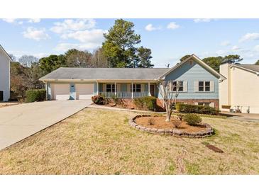 Charming single-story home with well-maintained landscaping and a two-car garage, perfect for suburban living at 2003 Graystone Pkwy, Grayson, GA 30017