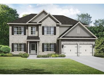 Two-story home showcasing stone and siding, a two-car garage, and a well-manicured lawn at 3261 Lions Ruby Ln, Atlanta, GA 30349