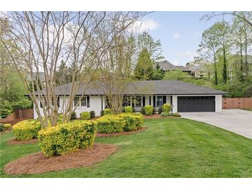 Charming one-story home with a well-manicured lawn and a two-car garage, offering great curb appeal at 2376 Academy Ne Ct, Atlanta, GA 30345
