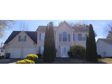 Charming two-story home with a two-car garage and well-maintained landscaping at 3247 Sugar Creek Se Trce, Atlanta, GA 30316