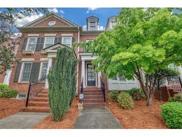 Charming two-story brick townhouse with landscaped front yard, and classic architectural details at 6206 Carriage Gate Se Ln # 6, Mableton, GA 30126