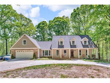 Charming home with a welcoming front porch and attached two-car garage at 4336 Yancey Rd, Douglasville, GA 30135