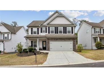 Charming two-story home featuring a two-car garage, landscaped yard, and a welcoming entrance at 531 S Fortune Way, Dallas, GA 30157