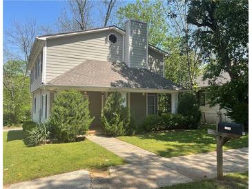 Charming two-story home with a covered front porch and well-maintained landscaping at 1326 Mcpherson Ave., Atlanta, GA 30316