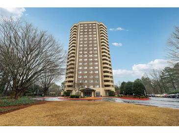 Beautiful building with a circle drive and covered entry with mature trees at 1501 Clairmont Rd # 1624, Decatur, GA 30033