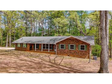 Charming brick ranch-style home with green shutters, offering a classic and inviting curb appeal at 285 Glen Ne Rd, Conyers, GA 30013