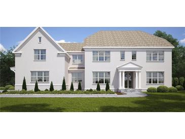 Charming two-story home boasts a white brick exterior, well-manicured lawn, and elegant architectural details at 1445 West Wesley Ne Rd, Atlanta, GA 30327