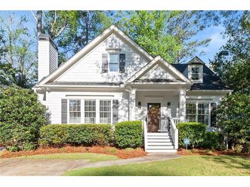 Charming home featuring a manicured lawn, welcoming entryway, and classic architectural details at 2930 Ringle Rd, Brookhaven, GA 30341