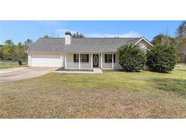 Charming single-story home featuring a welcoming front porch, attached garage, and well-maintained landscaping at 173 Michael Ln, Mcdonough, GA 30252