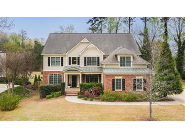 Charming two-story home featuring manicured landscaping and a welcoming front porch at 510 Towneside Ln, Marietta, GA 30064