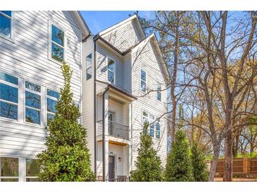 Beautiful exterior elevation featuring a balcony, well-maintained landscaping, and modern architectural details at 490 Hammons Way, Atlanta, GA 30315