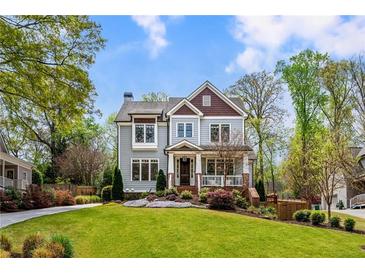 Charming two-story home with a landscaped yard, covered porch, and inviting curb appeal at 1861 8Th St, Atlanta, GA 30341