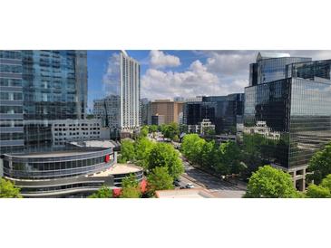Stunning city view featuring modern buildings, lush trees, and clear blue skies at 3324 Peachtree Ne Rd # 905, Atlanta, GA 30326