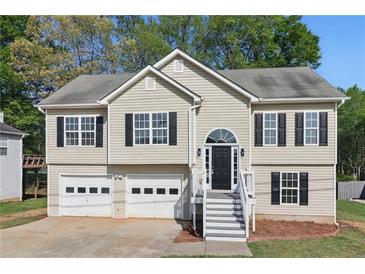 Charming two-story home with black shutters, a two car garage, and a welcoming front entrance at 176 Villa Rosa Rd, Temple, GA 30179