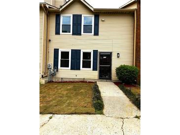 Inviting two-story home with blue shutters and a well-maintained lawn at 912 Holden Ln, Atlanta, GA 30349