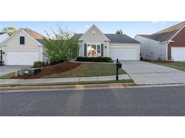 Charming single-Gathering home with well-manicured lawn and attached garage in quiet neighborhood at 3915 Deerborne Dr, Cumming, GA 30040