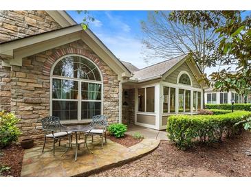 Charming stone exterior with a quaint seating area and a well-maintained garden at 3344 Timbersedge Dr # 5, Marietta, GA 30064
