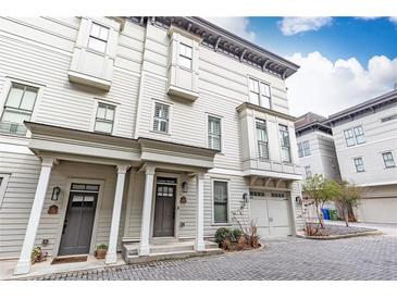 Inviting townhome with a private entrance, well-manicured landscaping, and an attached garage in a desirable community at 151 Flat Shoals Ave # 13, Atlanta, GA 30316