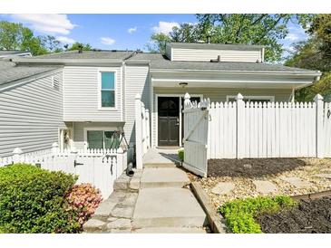Charming townhome featuring a landscaped front yard and a cozy, enclosed entrance at 2693 Greentree Se Dr, Marietta, GA 30067