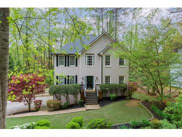Charming two-story home with landscaped yard and mature trees for privacy at 4270 Parnell Rd, Marietta, GA 30062