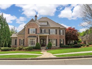 Beautiful brick home with manicured lawn and mature trees in a desirable neighborhood at 2114 Castlewycke Ct, Marietta, GA 30068