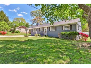 Charming single-story home featuring a lush lawn and well-maintained landscaping, great curb appeal at 3326 Chappel Lane, Peachtree Corners, GA 30360