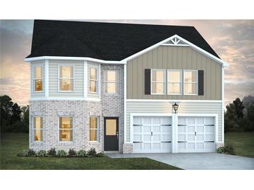 Charming two-story home featuring a brick facade, attached two-car garage and classic architectural design at 319 Overlook Rd, Covington, GA 30014