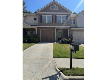 Charming two-story home with a well-maintained front yard, garage, and mailbox with visible address at 3627 Mcclaren Way, Lawrenceville, GA 30044
